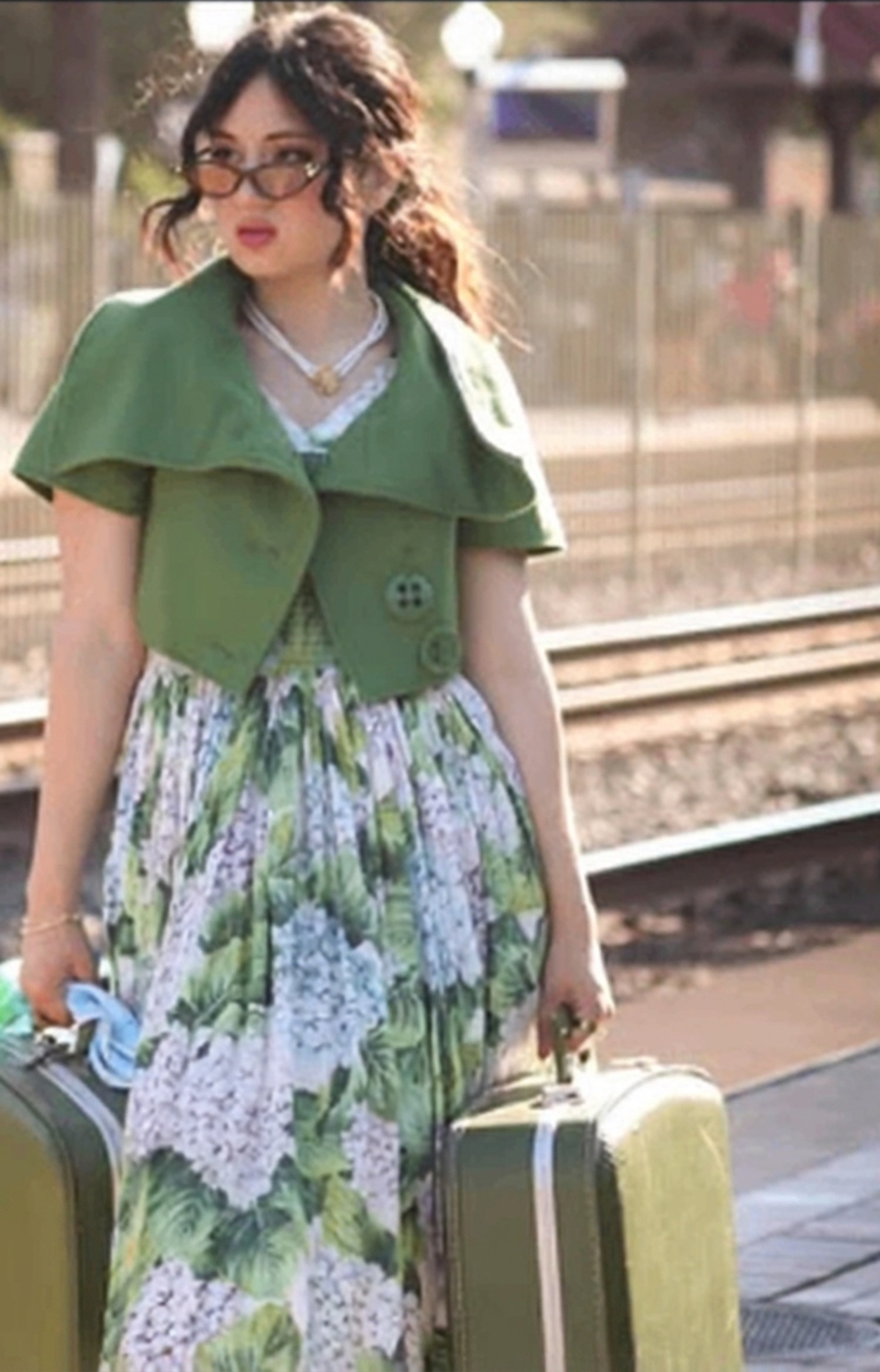 AALBA with vintage suitcases at a railway platform